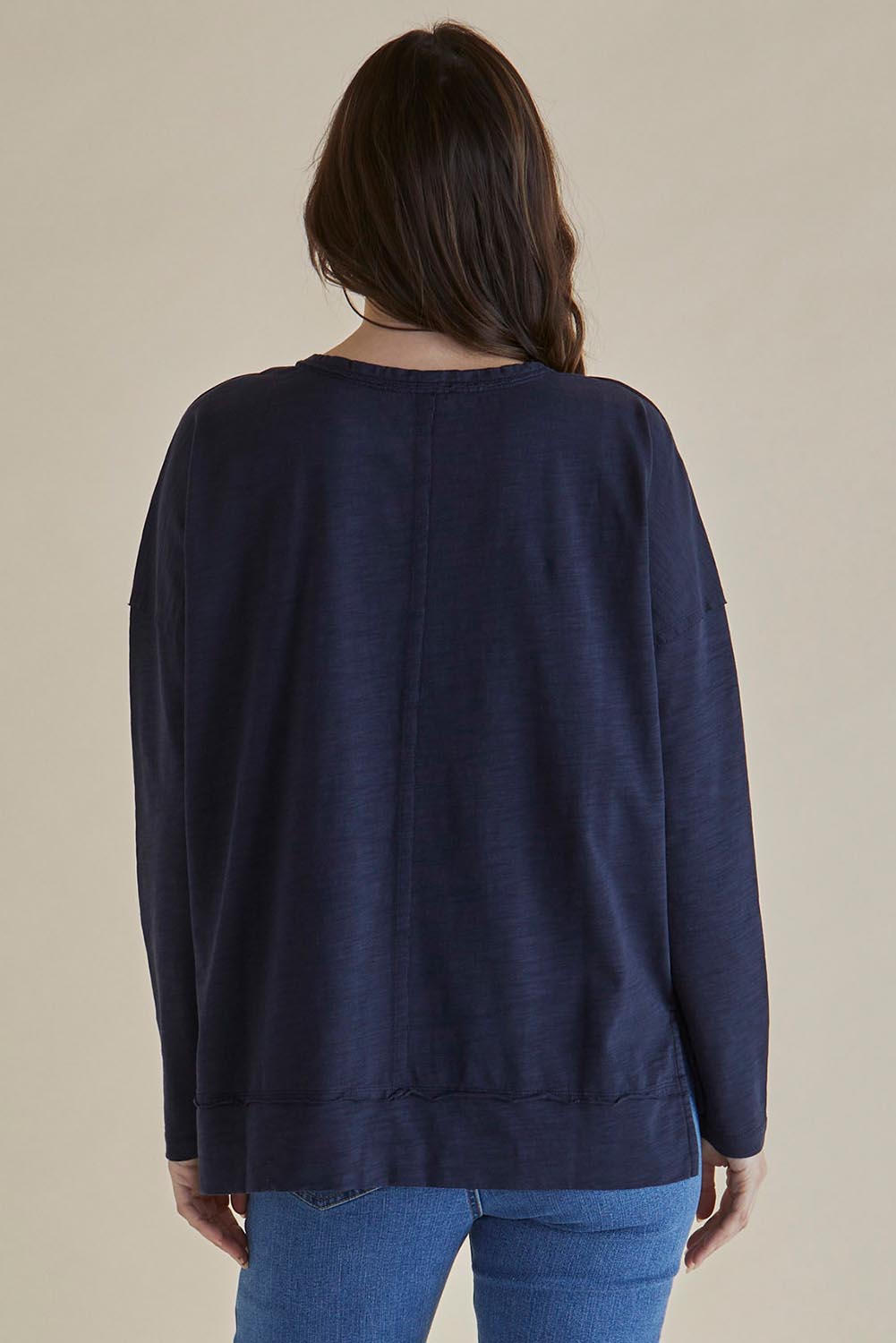A model wearing the Roxette Cotton Tee in colour Darkblue (Blue), from the back