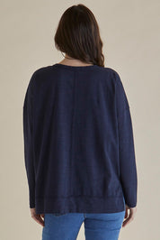 A model wearing the Roxette Cotton Tee in colour Darkblue (Blue), from the back