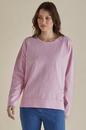 A model wearing the Roxette Cotton Tee in colour Pink (Pink), from the front, cropped image