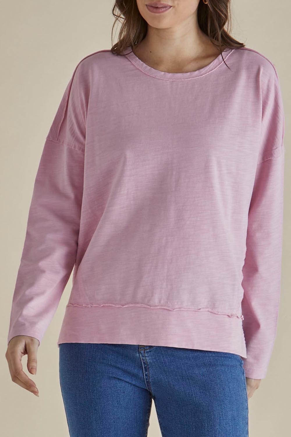 A model wearing the Roxette Cotton Tee in colour Pink (Pink), from the front, cropped image