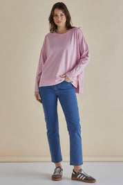 A model wearing the Roxette Cotton Tee in colour Pink (Pink), from the front, showing the whole outfit