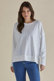 A model wearing the Roxette Cotton Tee in colour White (White), from the front, cropped image