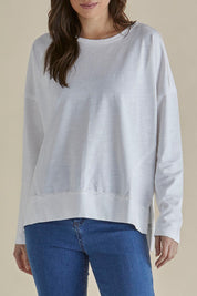 A model wearing the Roxette Cotton Tee in colour White (White), from the front, cropped image