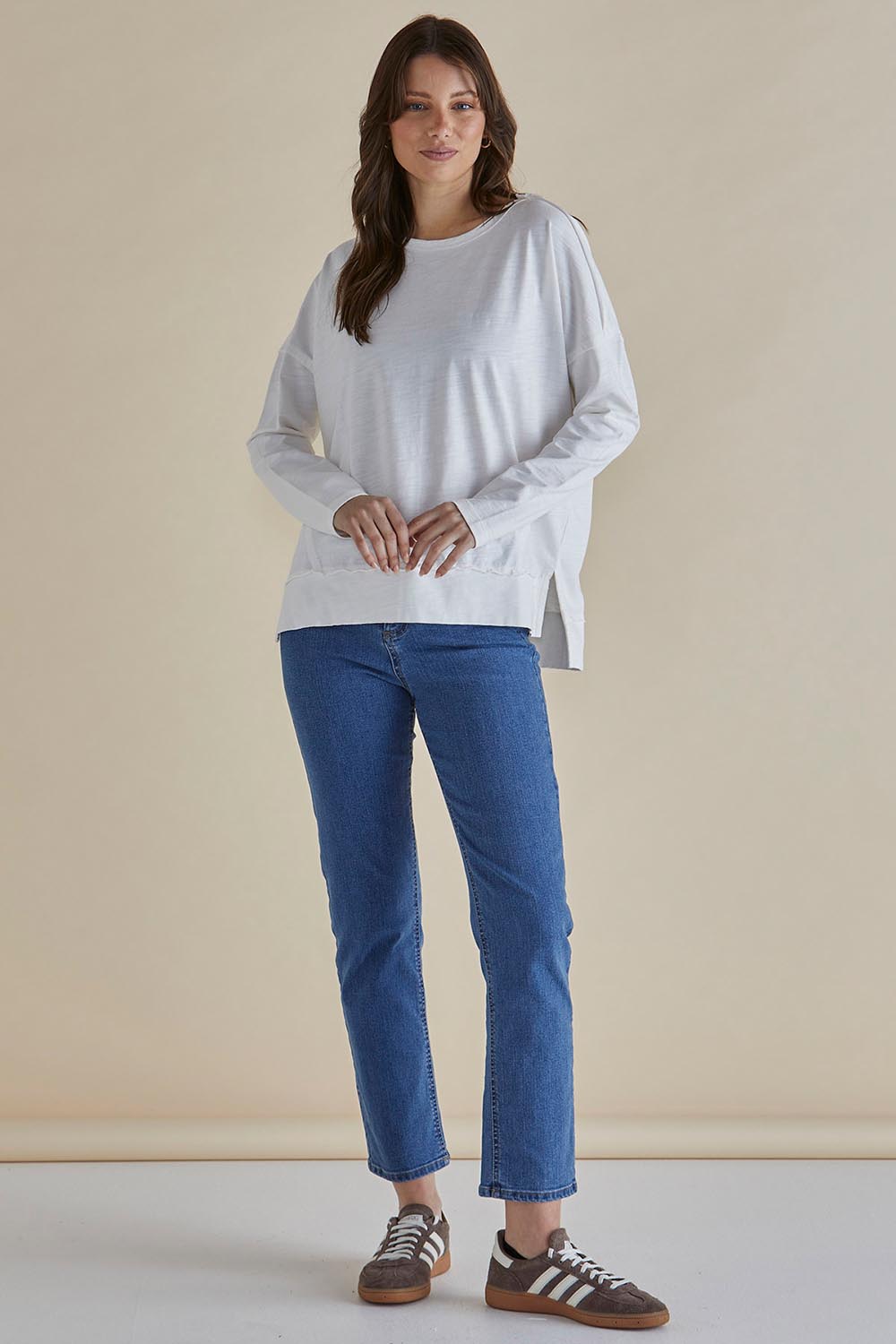 A model wearing the Roxette Cotton Tee in colour White (White), from the front, showing the whole outfit