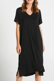 A model wearing the Irena Bamboo Tin colourShirt Dress - Black (Black), from the front, cropped image