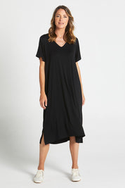 A model wearing the Irena Bamboo Tin colourShirt Dress - Black (Black), from the front, showing the whole outfit