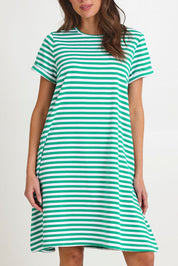 Model Madeline wearing size 10 of the Rue Cotton Dress in colour Green (Green), from the front, cropped image