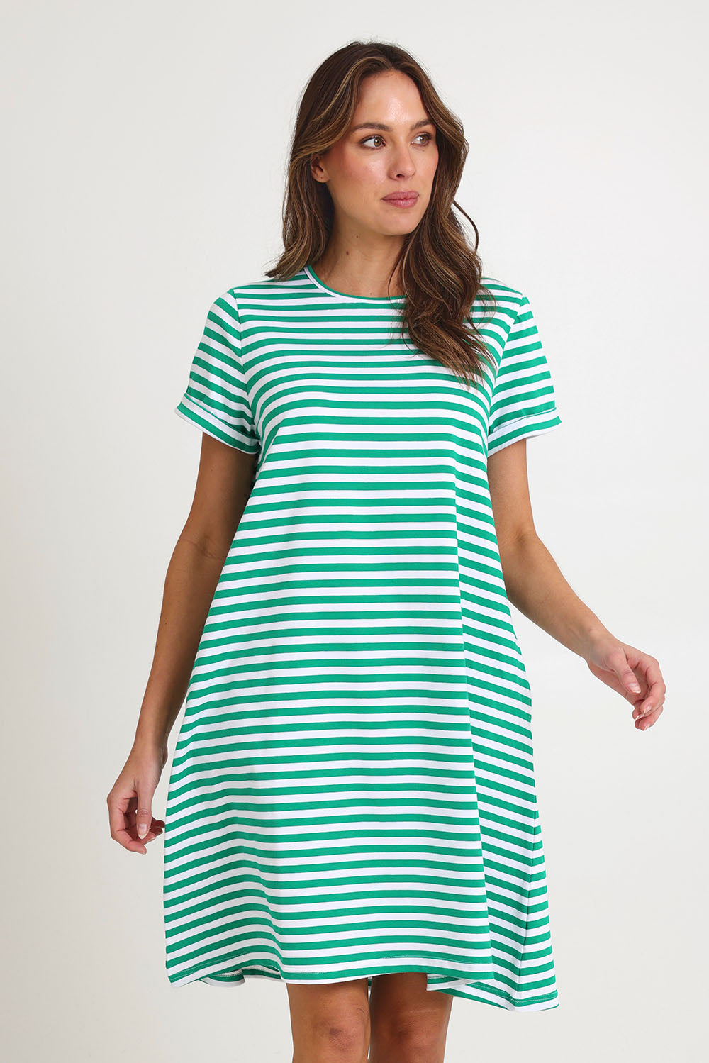 Model Madeline wearing size 10 of the Rue Cotton Dress in colour Green (Green), from the front, cropped image