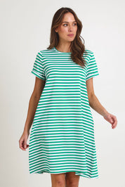 Model Madeline wearing size 10 of the Rue Cotton Dress in colour Green (Green), from the front, cropped image