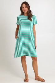 Model Madeline wearing size 10 of the Rue Cotton Dress in colour Green (Green), from the front, showing the whole outfit