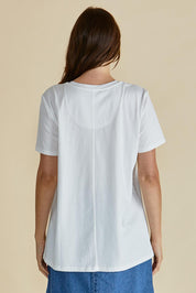 A model wearing the Ellia Cotton Crew Tee in colour Bomdia (White), from the back