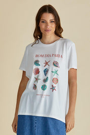 A model wearing the Ellia Cotton Crew Tee in colour Bomdia (White), from the front, cropped image