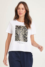 Model Madeline wearing size 10 of the Ellia Cotton Crew Tee in colour Floral (White), from the front, cropped image