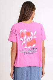 Model Madelinec wearing size 10 of the Ellia Print Tee – Italian in colour Italian, from the back