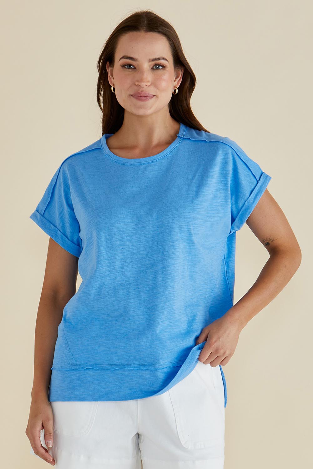 A model wearing the Shirley Cotton Short Sleeve Tee in colour Blue (Blue), from the front, cropped image