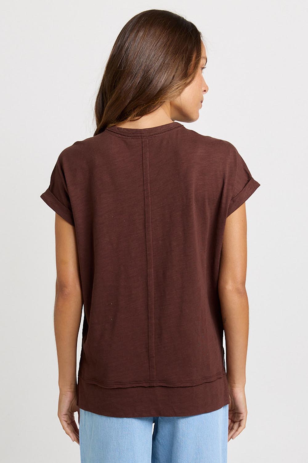 Model Genericm wearing size sample of the Shirley Short Sleeve Tee – Chocolate in colour Chocolate, from the back
