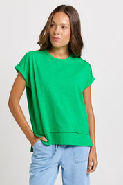 Model Genericm wearing size sample of the Shirley Short Sleeve Tee – Green in colour Green, in a cropped view