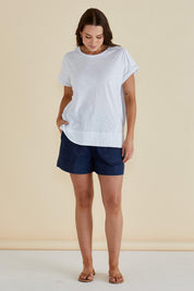A model wearing the Shirley Cotton Short Sleeve Tee in colour White (White), from the front, showing the whole outfit