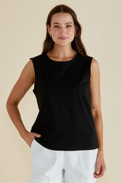 A model wearing the Jordyn Cotton Tank in colour Black (Black), from the front, cropped image