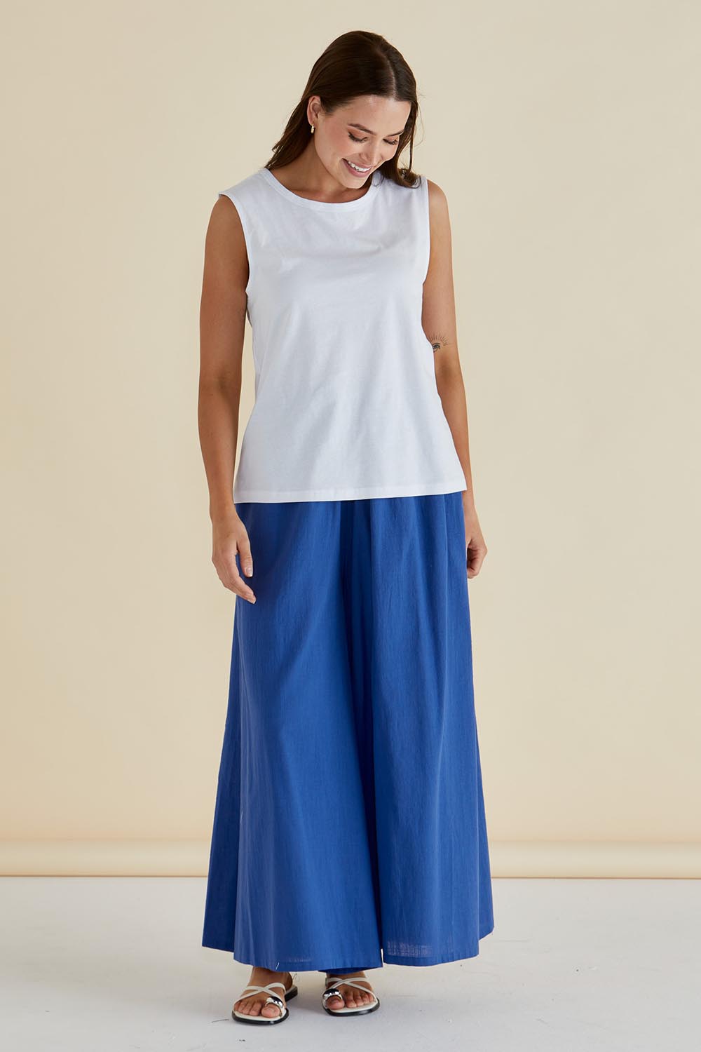 A model wearing the Jordyn Cotton Tank in colour White (White), from the front, showing the whole outfit