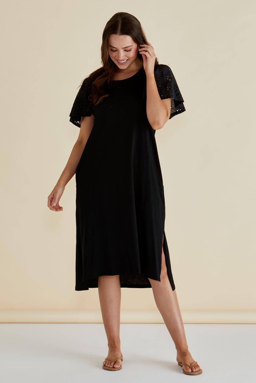 A model wearing the Sawyer Embroidered Cotton Dress in colour Black (Black), from the front, showing the whole outfit