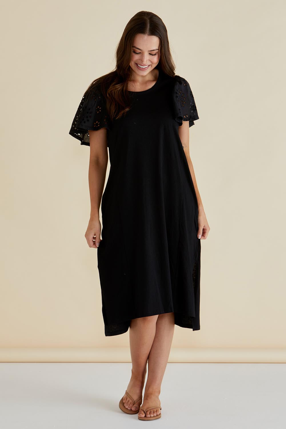 A model wearing the Sawyer Embroidered Cotton Dress in colour Black (Black), from the front, showing the whole outfit