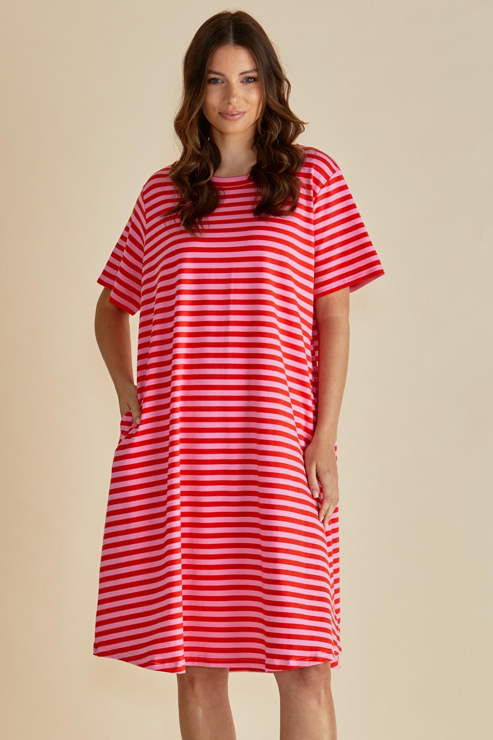 A model wearing the Eloise Cotton Tin colourShirt Dress - Pinkred (Red), from the front, cropped image