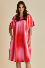 A model wearing the Eloise Cotton Tin colourShirt Dress - Pinkred (Red), from the front, cropped image
