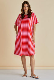 A model wearing the Eloise Cotton Tin colourShirt Dress - Pinkred (Red), from the front, showing the whole outfit