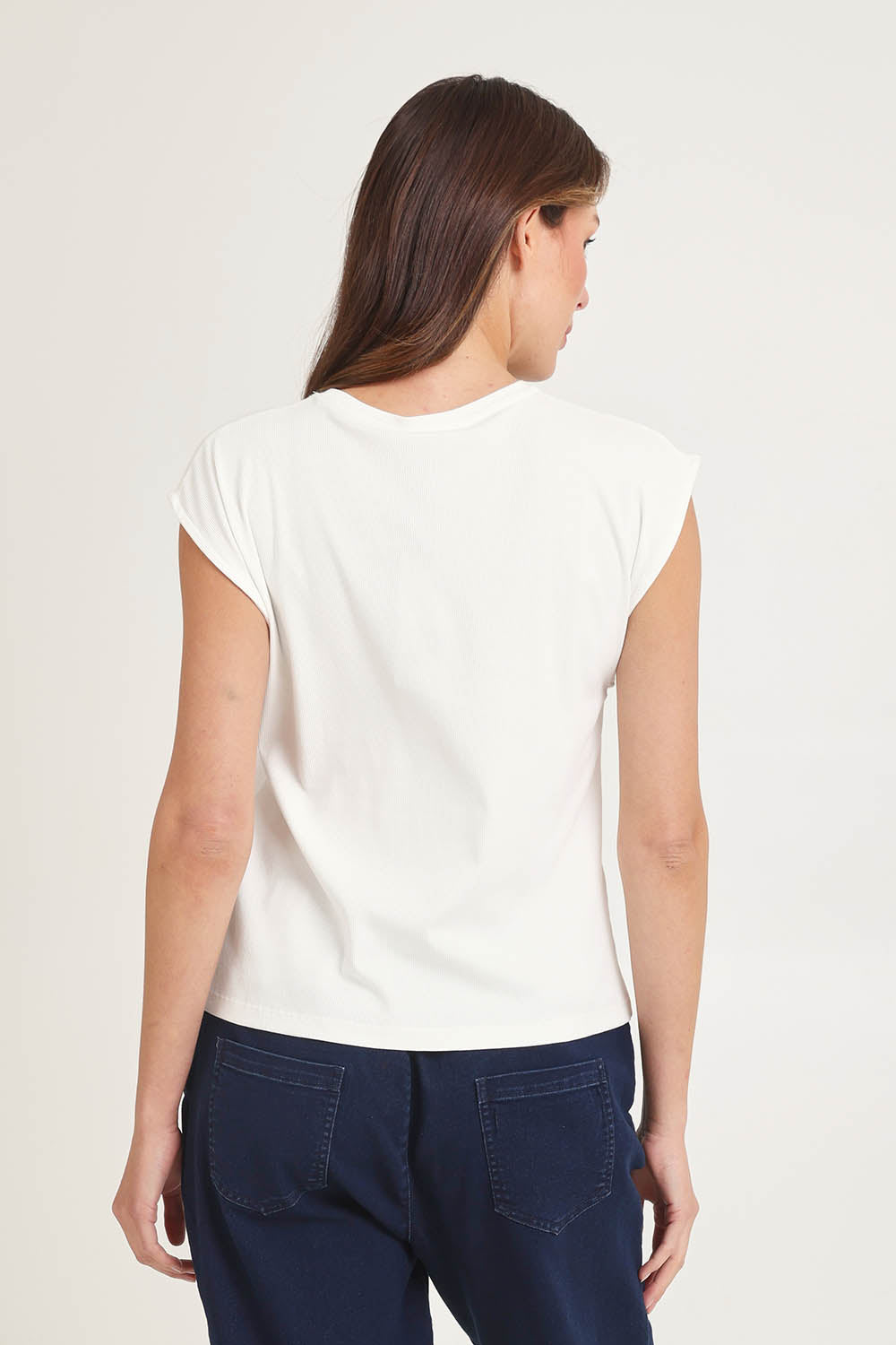 Model Madeline wearing size 10 of the Cuff Cotton Blend Rib Tee in colour White (White), from the back