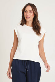 Model Madeline wearing size 10 of the Cuff Cotton Blend Rib Tee in colour White (White), from the front, cropped image