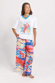 Model Genericm wearing size sample of the V-Neck Boxy Tee – Paradise in colour Paradise, from the front