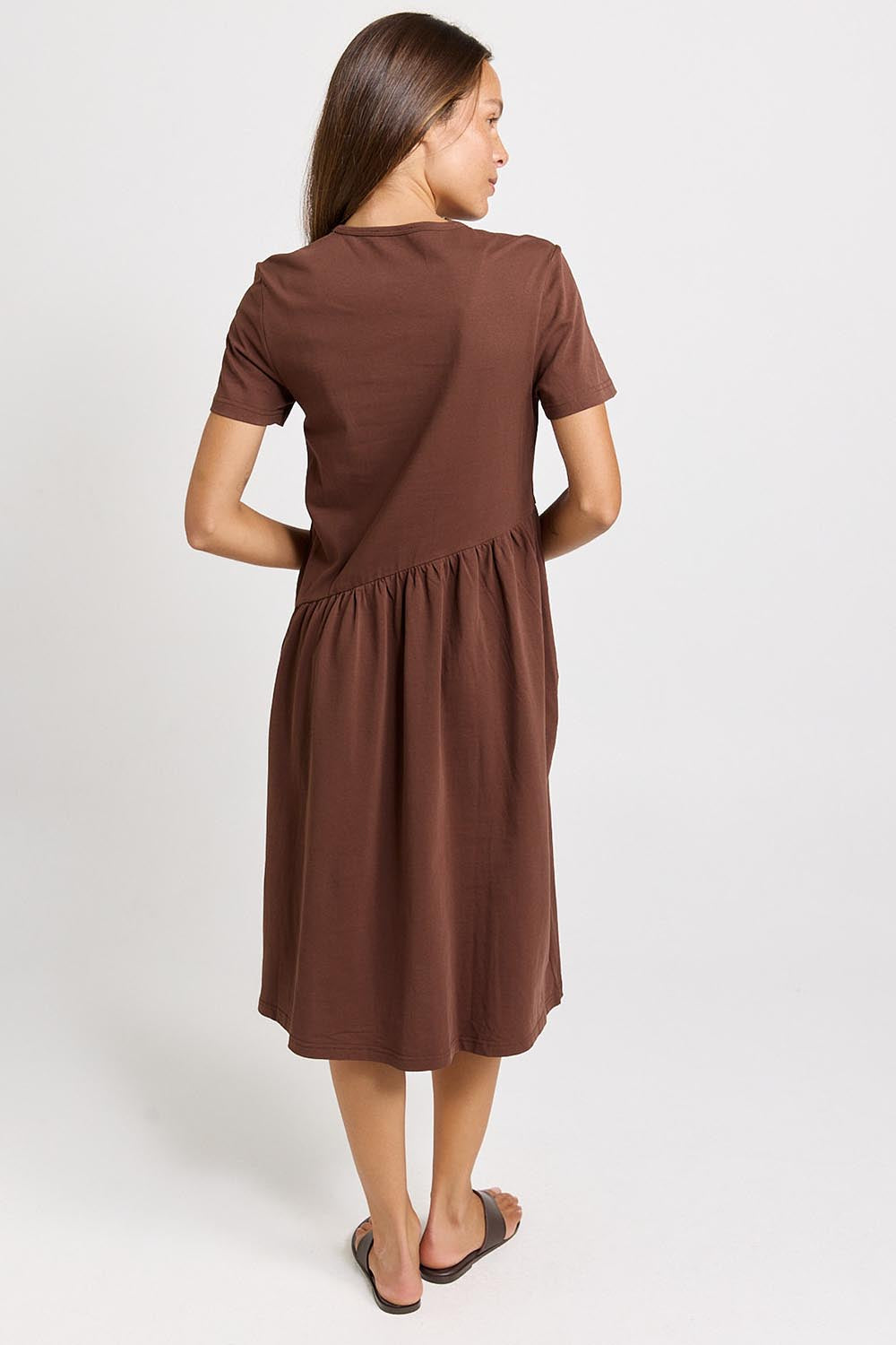Model Genericm wearing size sample of the Ava Asymmetrical Dress – Chocolate in colour Chocolate, from the front