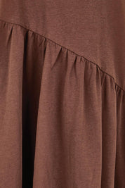 Product shot of the Ava Asymmetrical Dress – Chocolate in colour Chocolate, showing detail