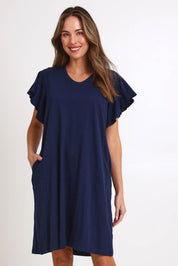 Model Madelinec wearing size 10 of the Celene Frill Dress – Navy in colour Navy, in a cropped view