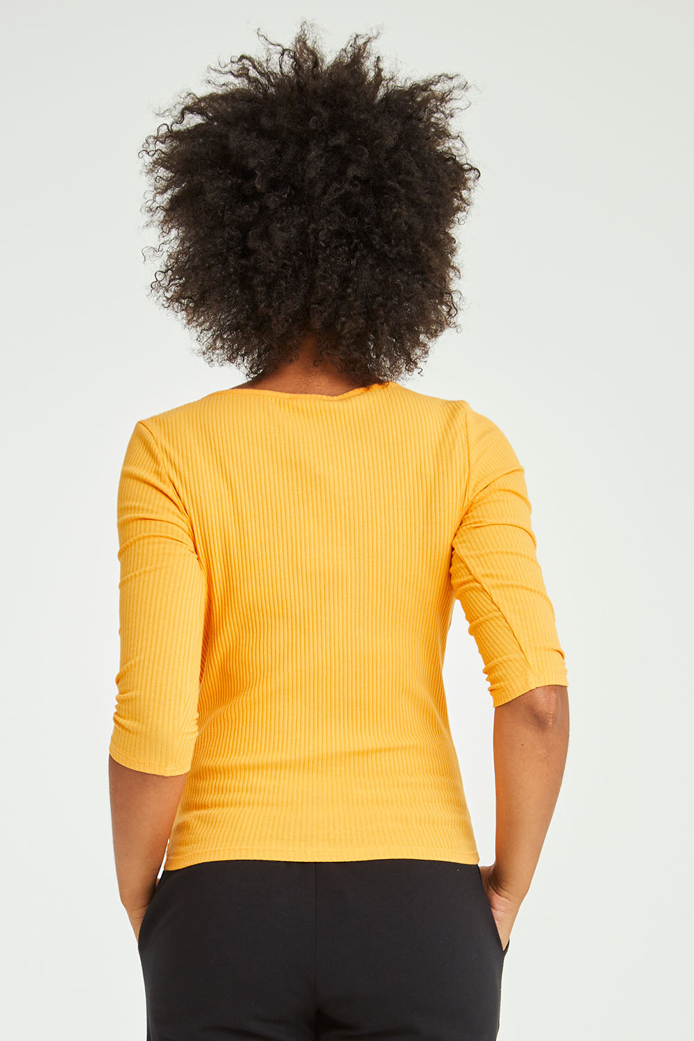 Model Olivia wearing size 10 of the Rosa 3/4 Rib Top in colour Mandarin, from the back