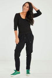 Model Katie wearing size 10 of the Rosa 3/4 Rib Top in colour Black (Black), from the front, showing the whole outfit