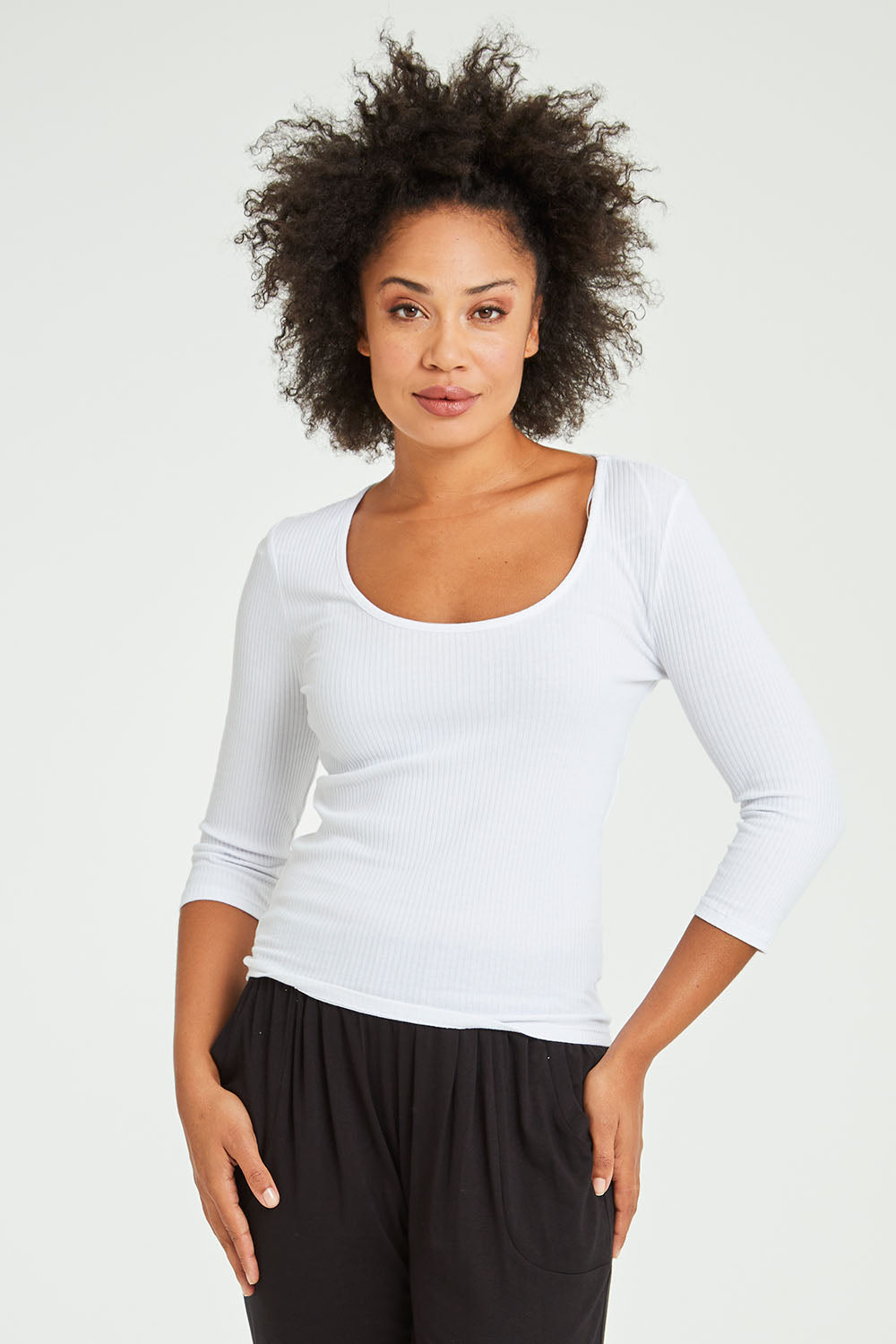 Model Olivia wearing size 10 of the Rosa 3/4 Rib Top in colour White (White), from the front, cropped image