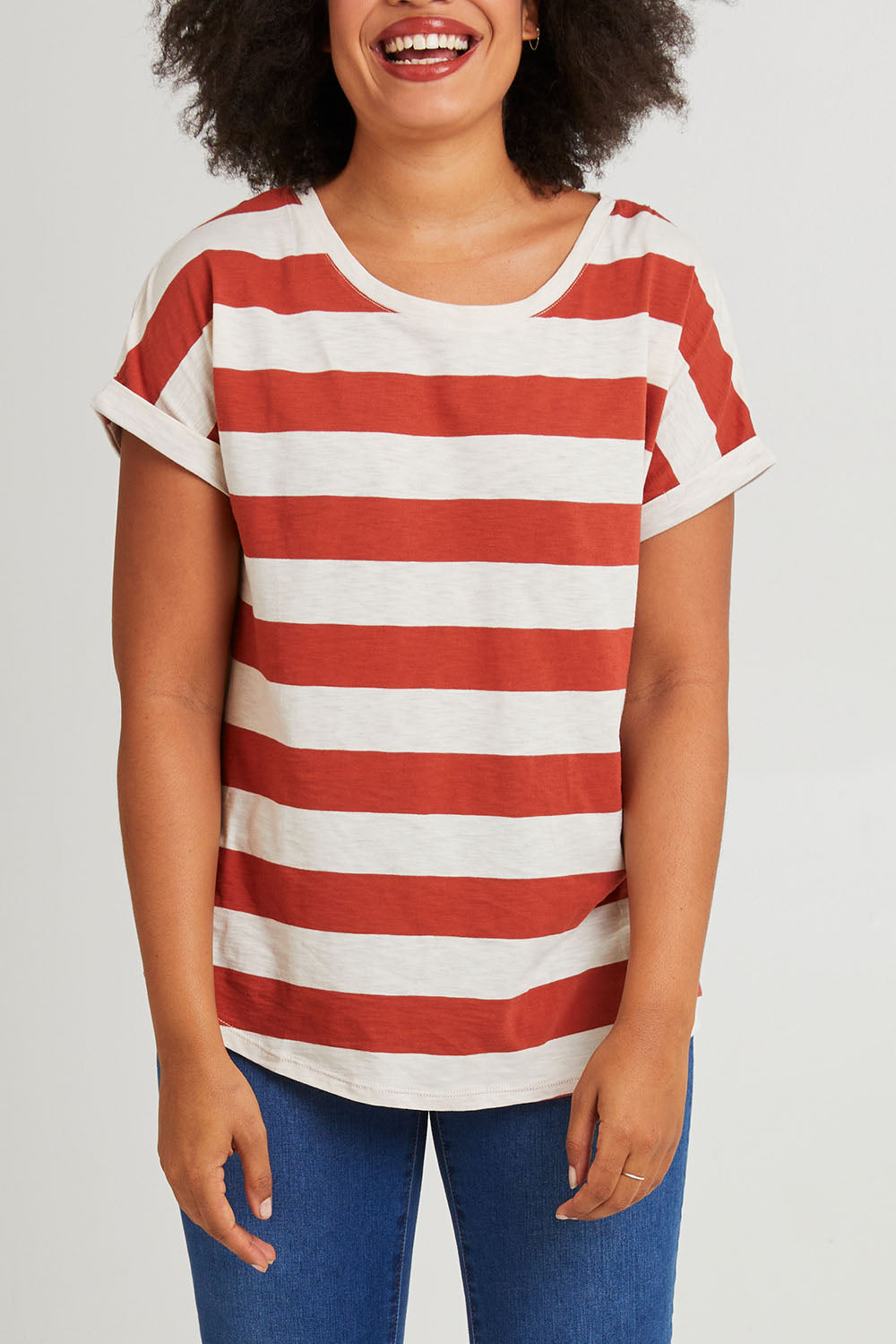 Model Olivia wearing size 10 of the Hailey Short Sleeve Tee in colour Terracotta, from the front, cropped image