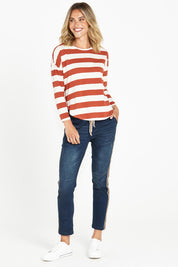 A model wearing the Jessie Long Sleeve Tee in colour Terracotta, from the front, showing the whole outfit