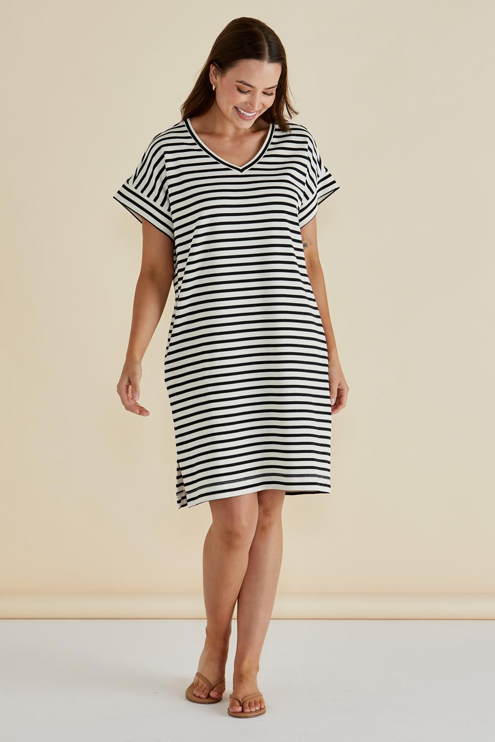A model wearing the Elise V Neck Cotton Rib Dress in colour Whiteblk, from the front, showing the whole outfit