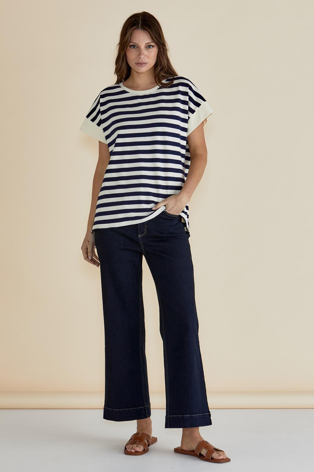 A model wearing the Willa Cotton Tee in colour Navystripe (Blue), from the front, showing the whole outfit