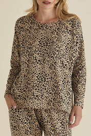 A model wearing the Brixley Long Sleeve Cotton Top in colour Leopard, from the front, cropped image
