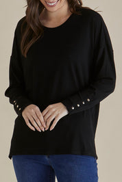 A model wearing the Hendrix Ribbed Long Sleeve Tee in colour Black (Black), from the front, cropped image