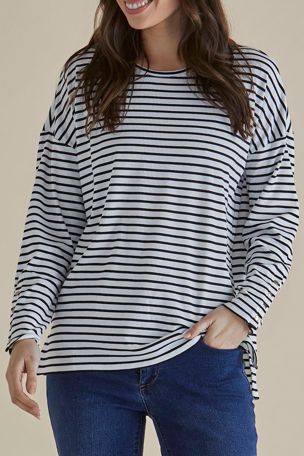 A model wearing the Hendrix Ribbed Long Sleeve Tee in colour Stripe (White), from the front, cropped image