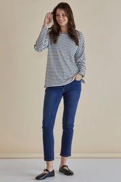 A model wearing the Hendrix Ribbed Long Sleeve Tee in colour Stripe (White), from the front, showing the whole outfit
