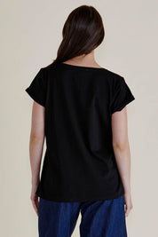 A model wearing the Ayla Vin colourNeck Cotton Tee - Black (Black), from the back