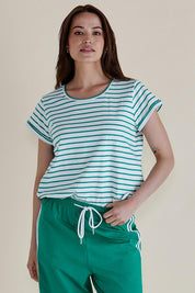 A model wearing the Caia Cotton Crew Tee in colour Grnstripe (Green), from the front, cropped image