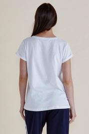 A model wearing the Caia Cotton Crew Tee in colour White (White), from the back