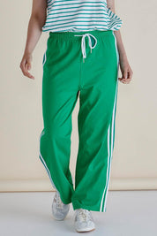 A model wearing the Nikki Relax Cotton Jogger in colour Green (Green), from the front, cropped image